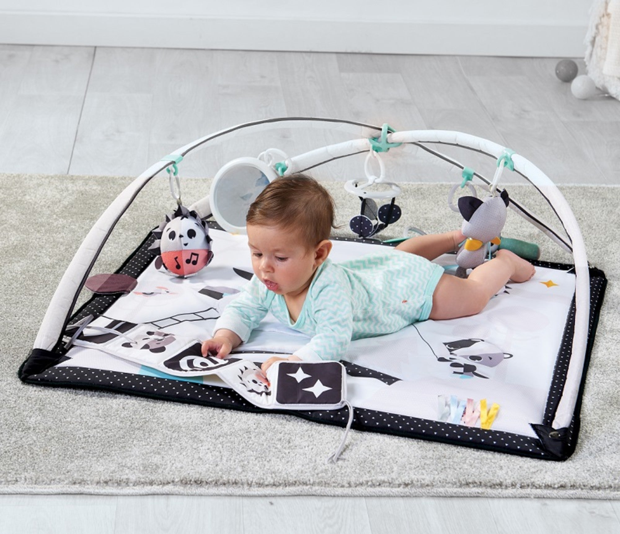 Baby playing on Tiny Love Black & White Gymini