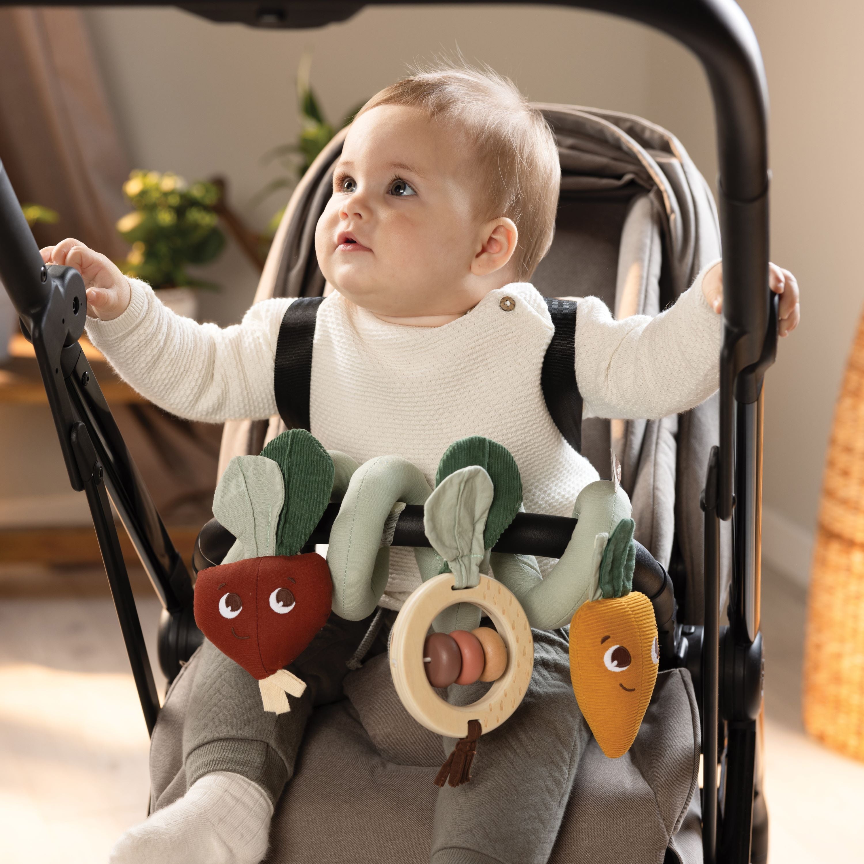 Spiral Stroller Activity Toy - baby in stroller with toy attached