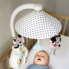 Magical Night 3-in-1 Projector Mobile - baby looking up at mobile in crib